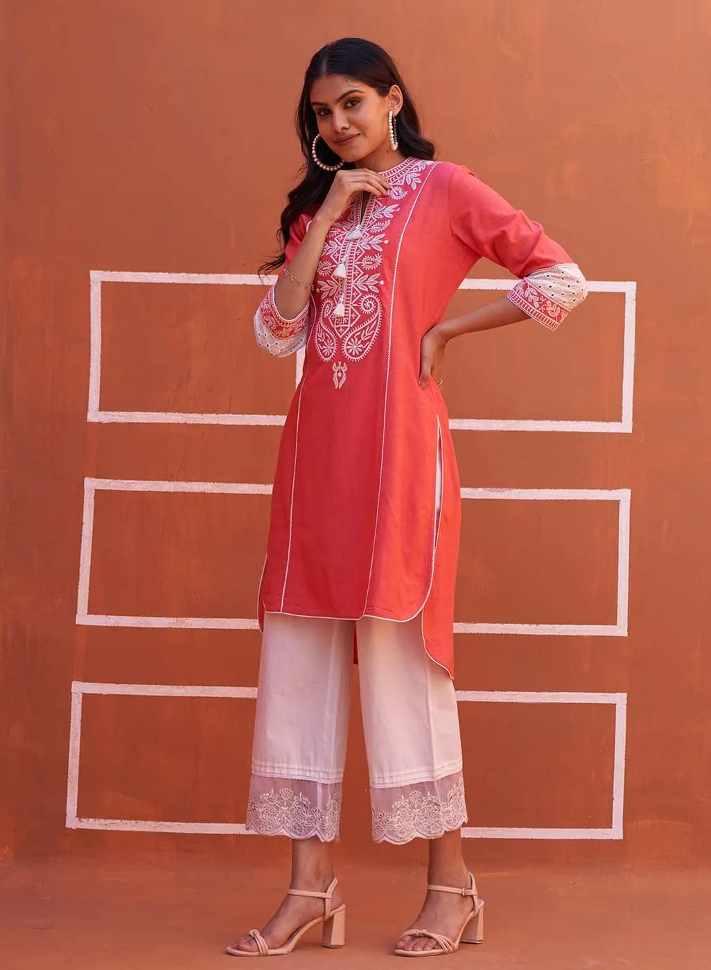 Peach Embroidered Kurta with Asymmetric Hem and Schiffili Detailing on the Sleeves