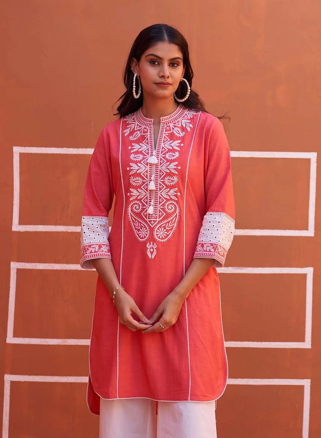 Peach Embroidered Kurta with Asymmetric Hem and Schiffili Detailing on the Sleeves