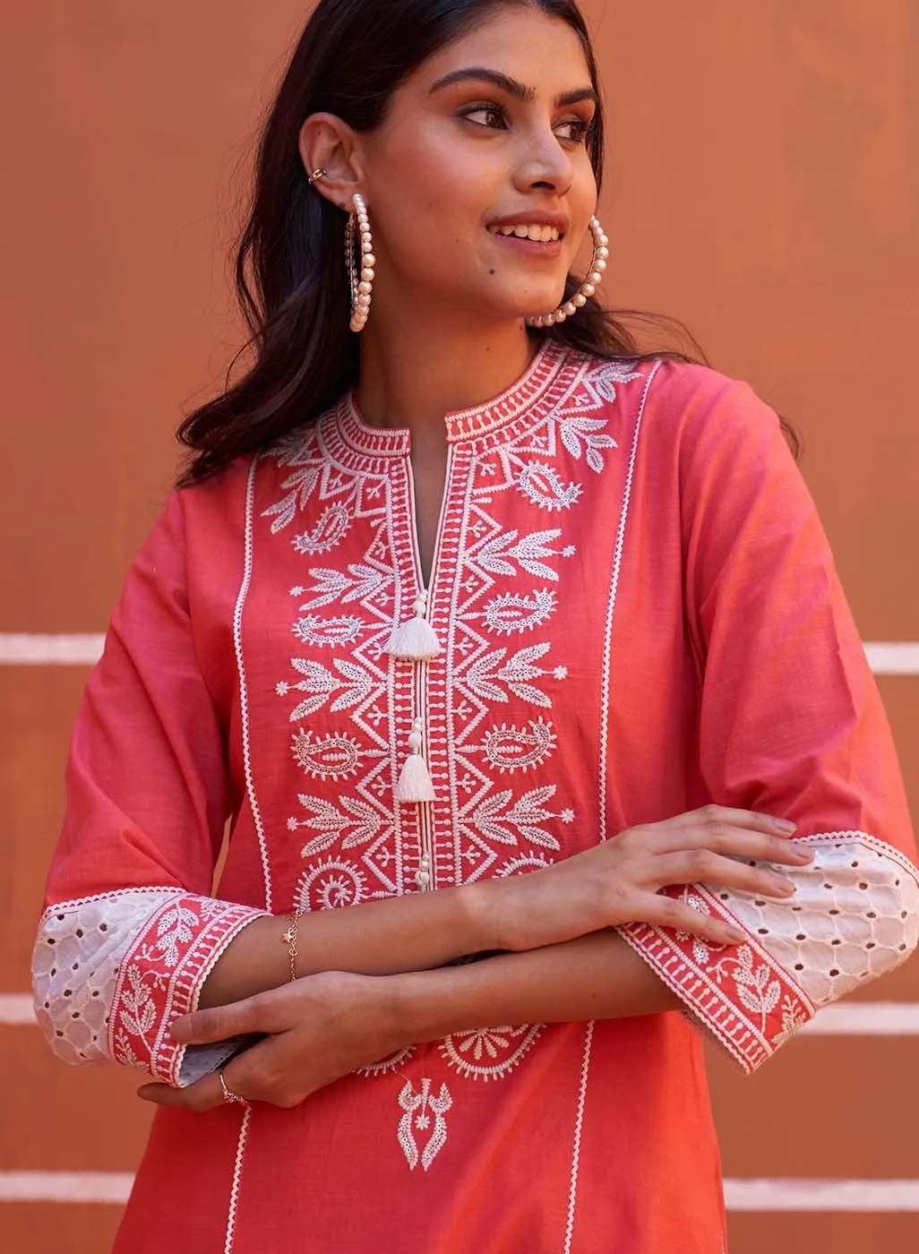 Peach Embroidered Kurta with Asymmetric Hem and Schiffili Detailing on the Sleeves