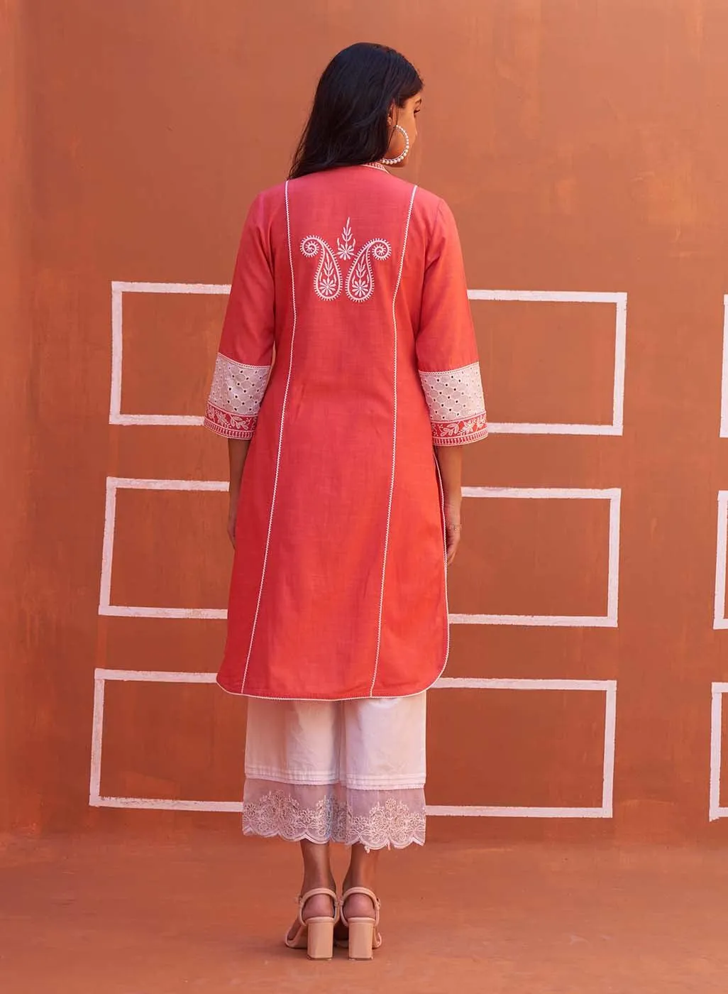 Peach Embroidered Kurta with Asymmetric Hem and Schiffili Detailing on the Sleeves