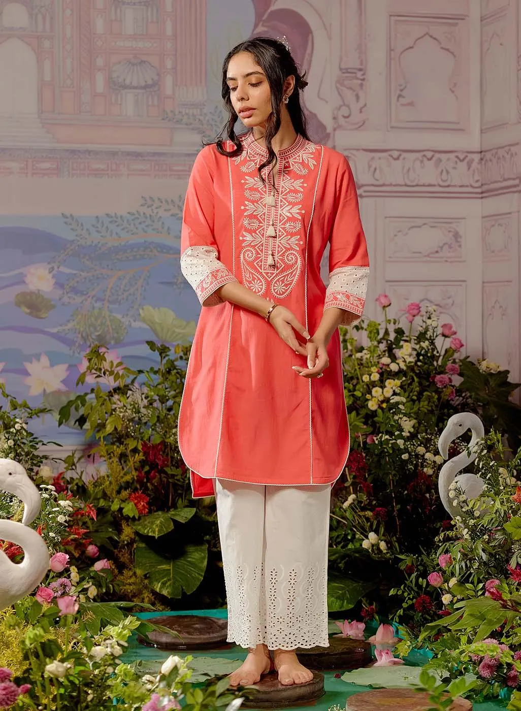 Peach Embroidered Kurta with Asymmetric Hem and Schiffili Detailing on the Sleeves