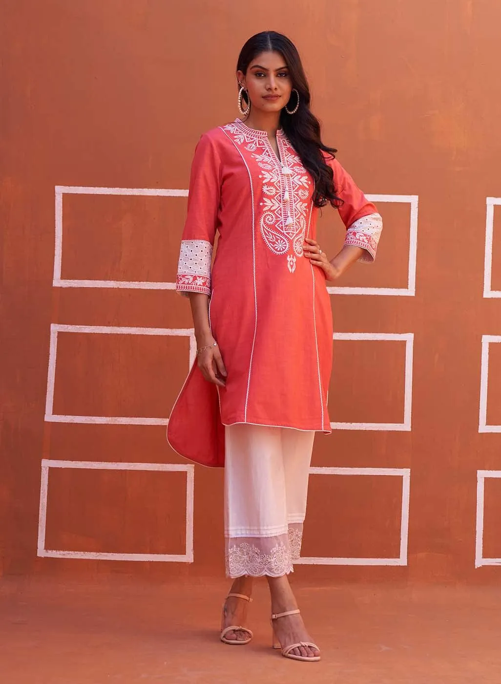 Peach Embroidered Kurta with Asymmetric Hem and Schiffili Detailing on the Sleeves