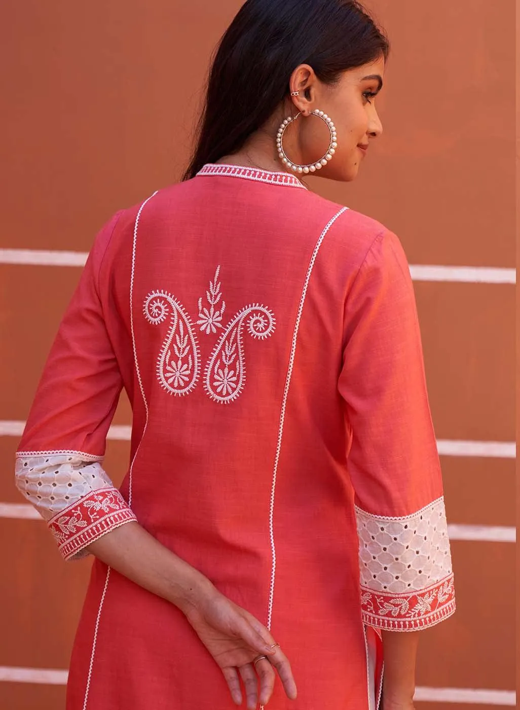 Peach Embroidered Kurta with Asymmetric Hem and Schiffili Detailing on the Sleeves