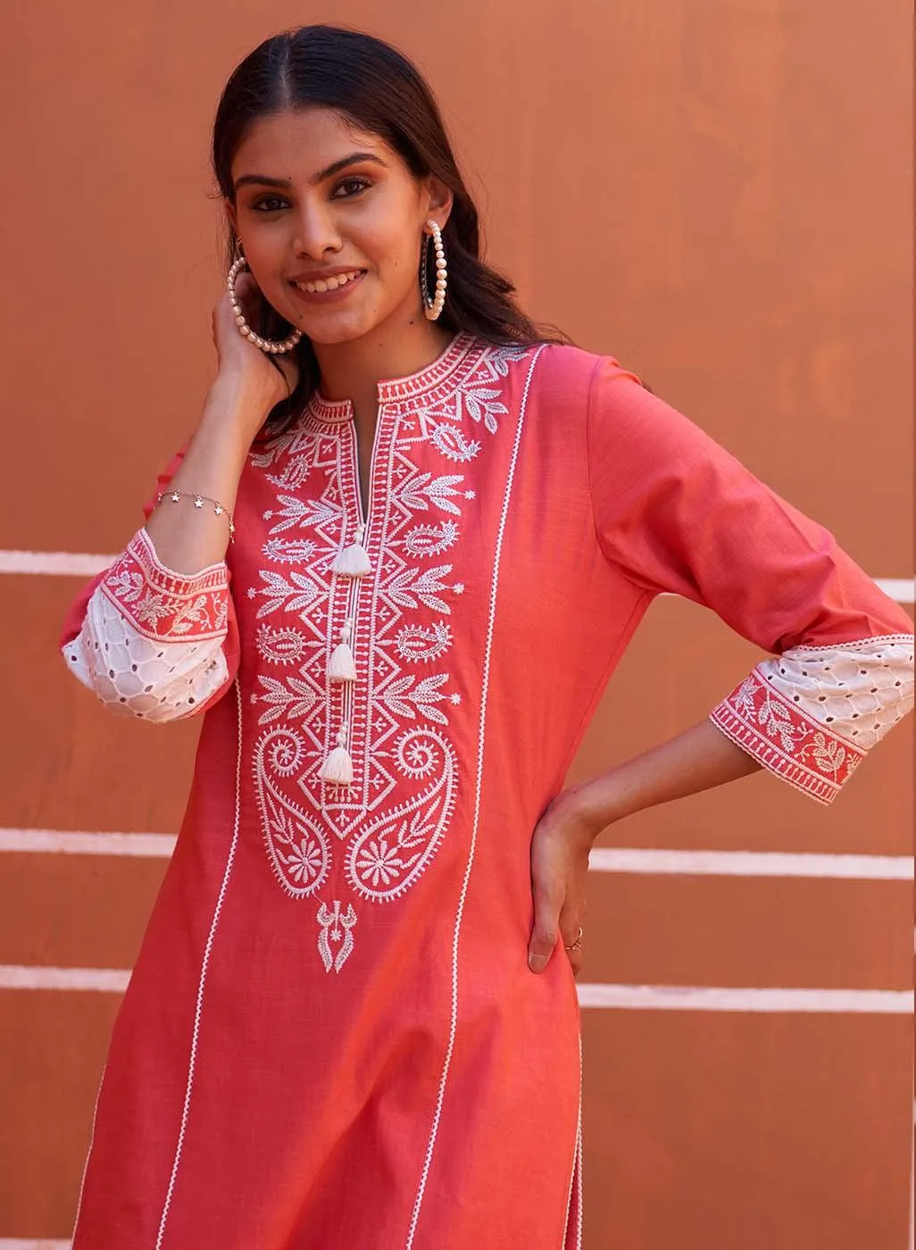 Peach Embroidered Kurta with Asymmetric Hem and Schiffili Detailing on the Sleeves