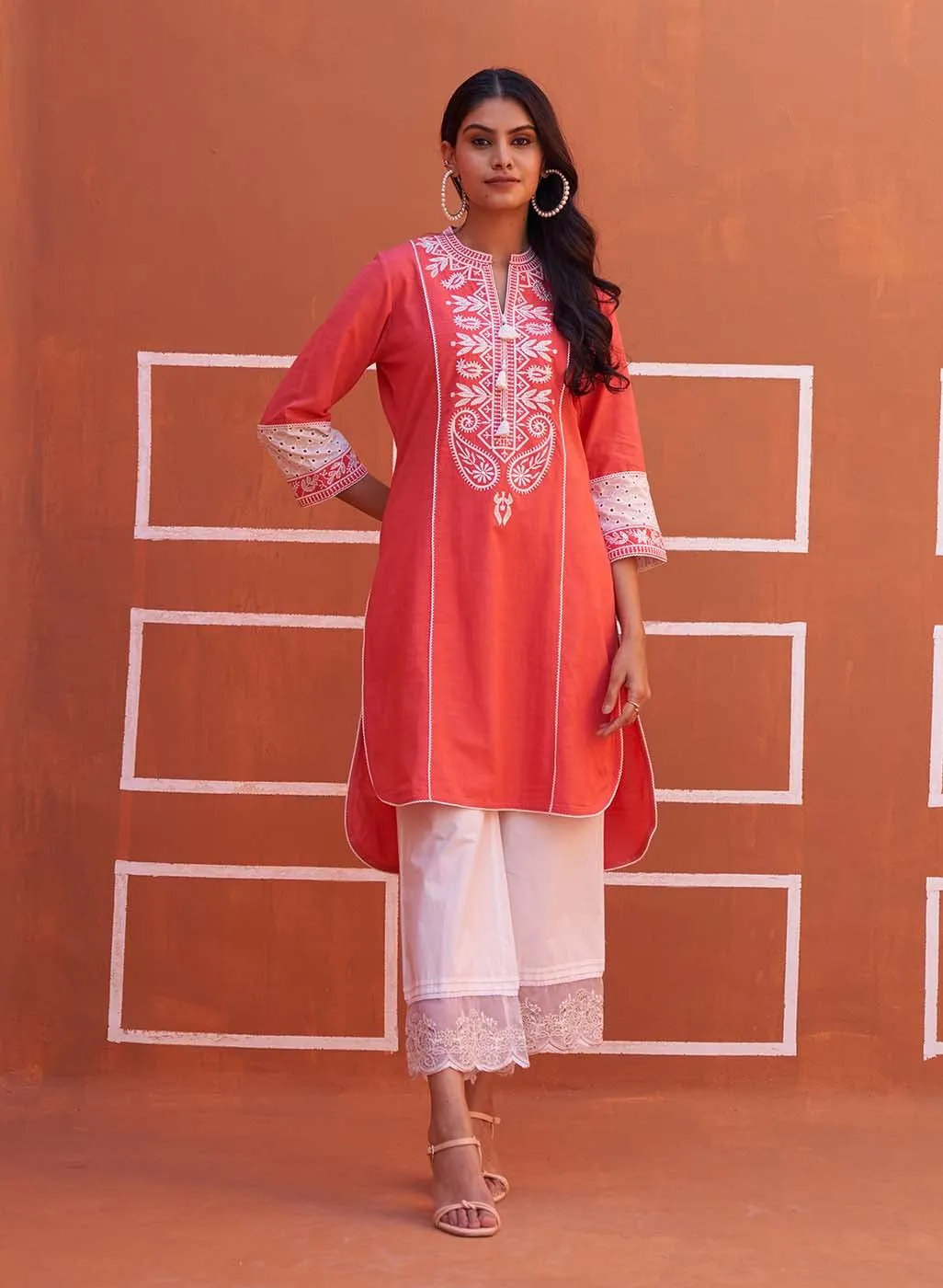 Peach Embroidered Kurta with Asymmetric Hem and Schiffili Detailing on the Sleeves